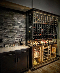 A wine cellar with glass enclosure and metal wine racking.