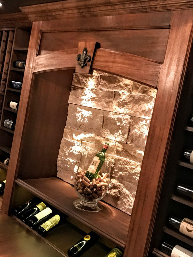 A wooden holder for wine bottles