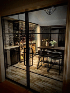 A beautifully designed custom wine cellar with wood racks and ambient lighting.