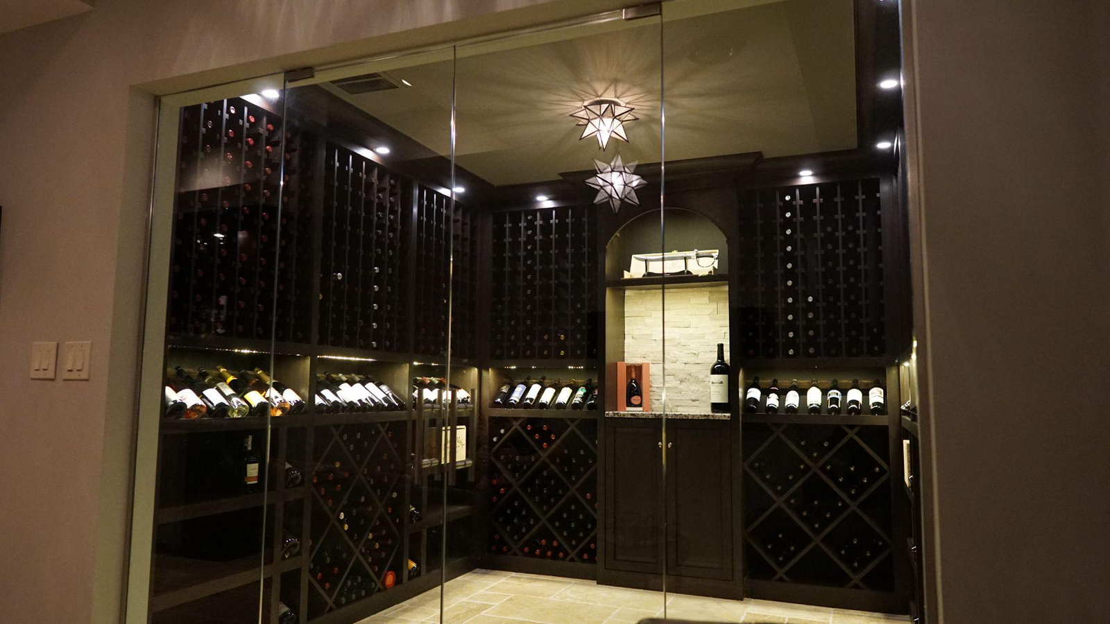 A wine cellar with glass doors