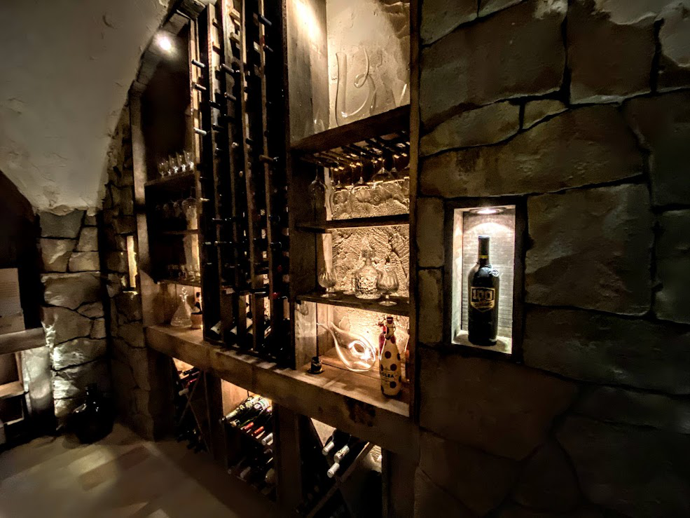 A wine room with metal racks