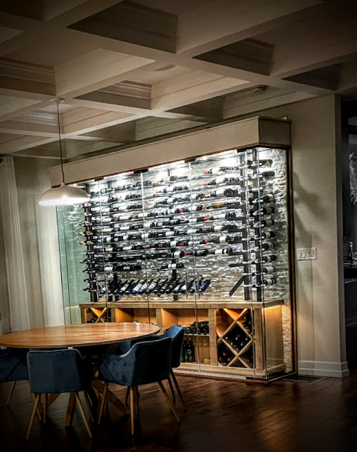 A compact, stylish wine room with floor-to-ceiling bottle storage.