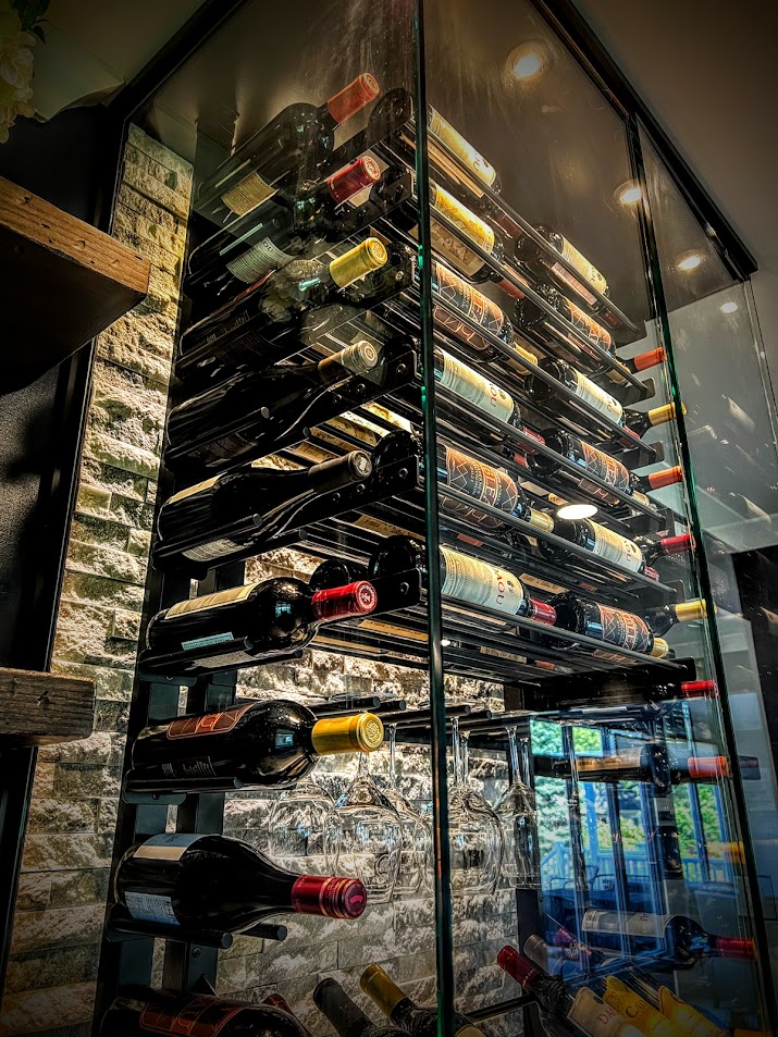 Contemporary wine cellar by Baroque Design featuring floating racks