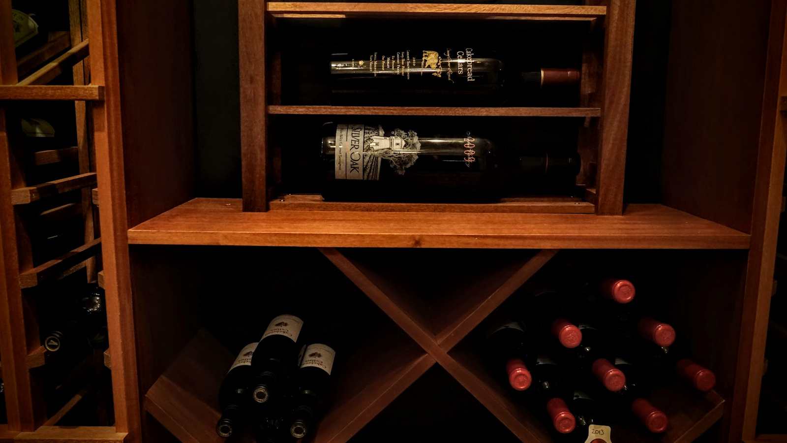 Custom wooden wine cellar rack with horizontal bottle storage