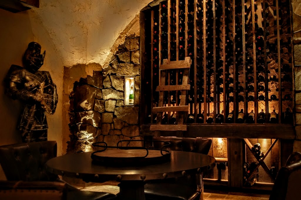 Softly lit wine cellar with organized label-forward storage