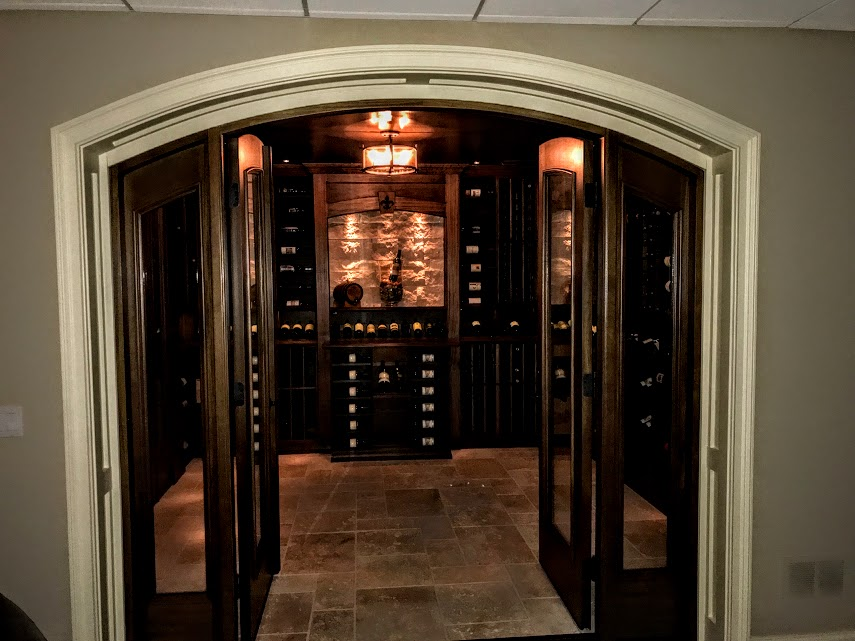 Double doors opening to a wine cellar