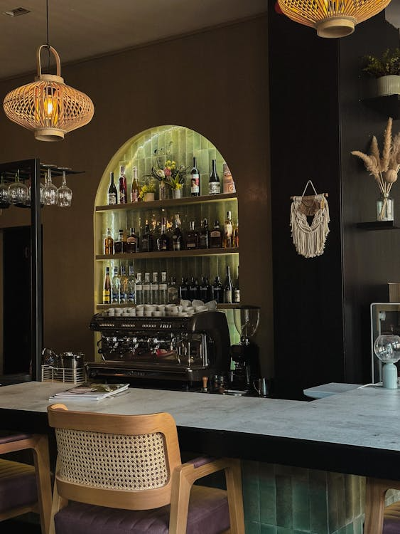 A large wine cellar built into the wall with glass behind it
