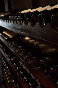 A large wine cellar with age-old wine bottles.