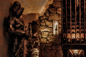 A wine cellar with a knight's armor decor
