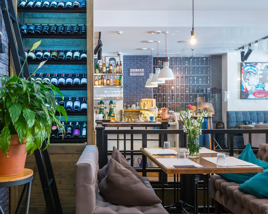Modern rustic kitchen area with a large wine cellar at the side