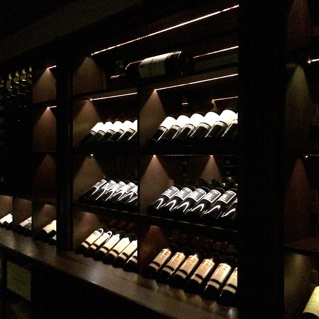 A wine bottle display on modern racks