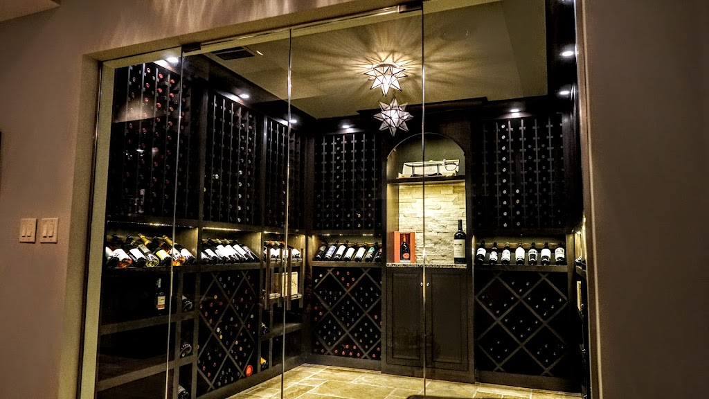 A sleek, glass-enclosed wine cellar with dark wood racks, accent lighting, and neatly stored wine bottles